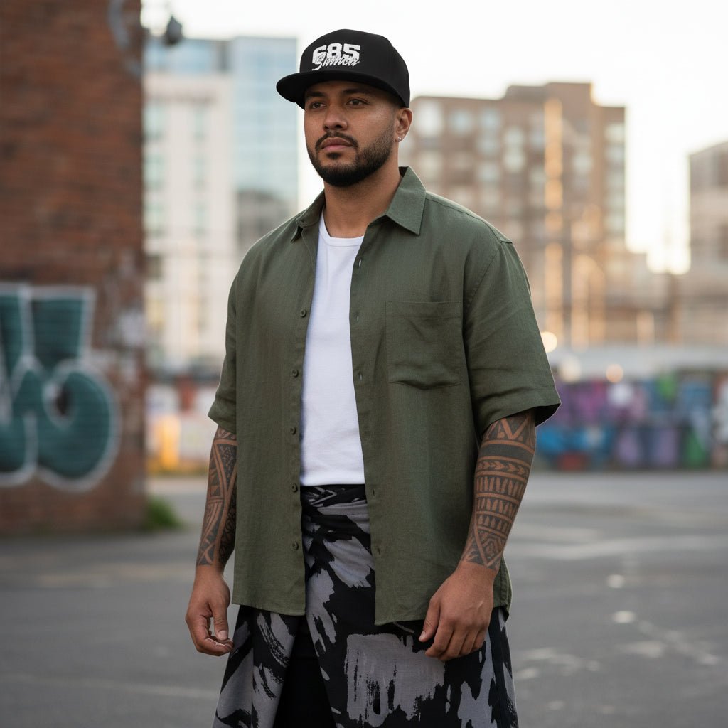 Fulfill Engine flat bill snapback hat in black with white Samoa embroidery, featuring a one-size design and adjustable strap.