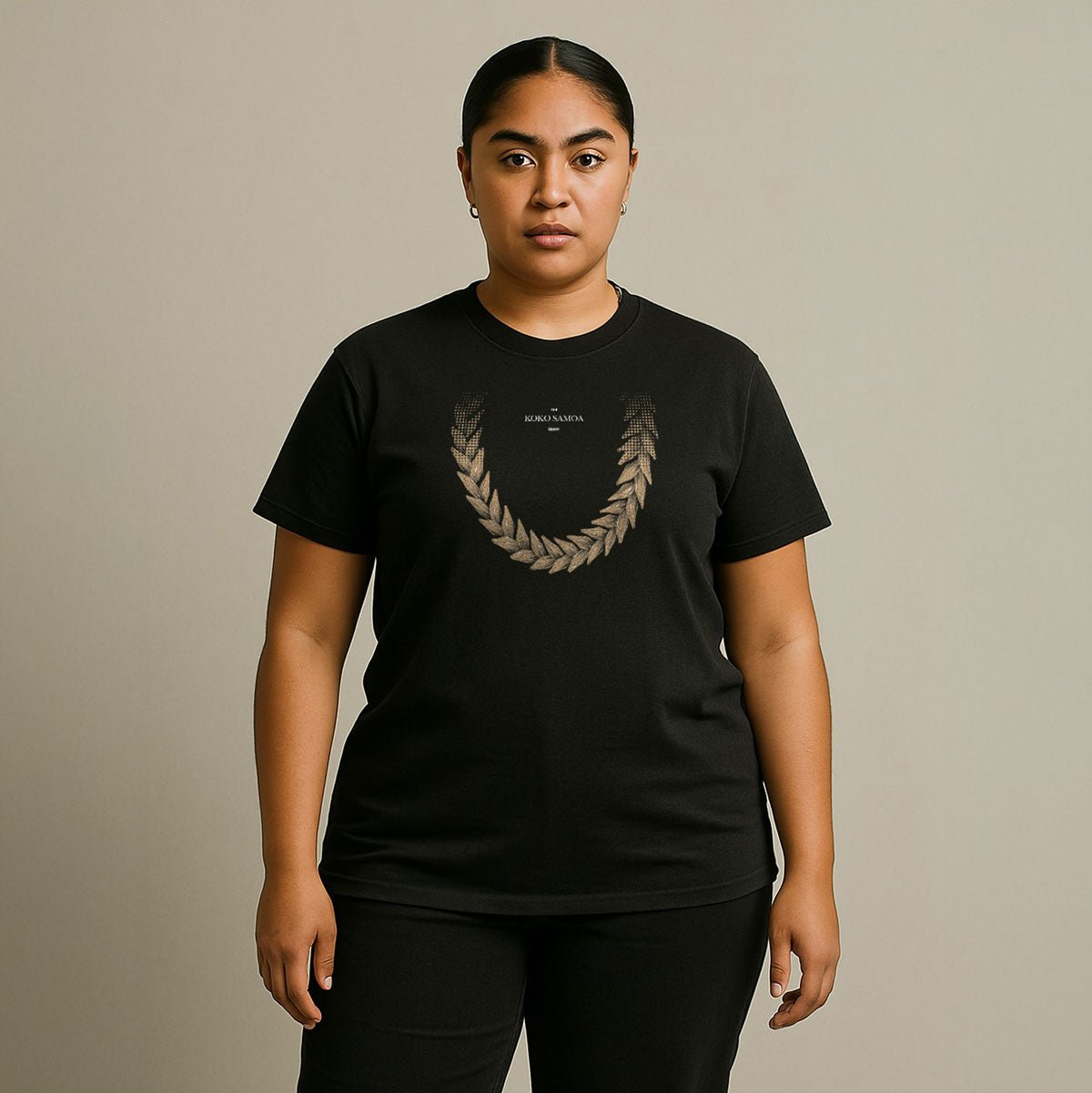 Soft unisex T-shirt in brown featuring Ula Fala design, shown in black color in a close-up view.