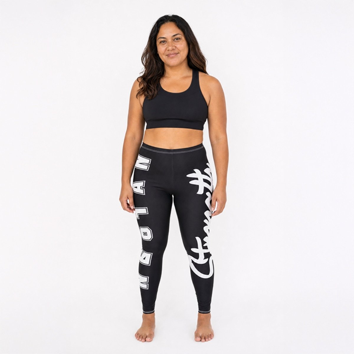 Mid-rise casual leggings by MWW On Demand with Nesian Strength design, featuring comfortable fit and stylish pattern.