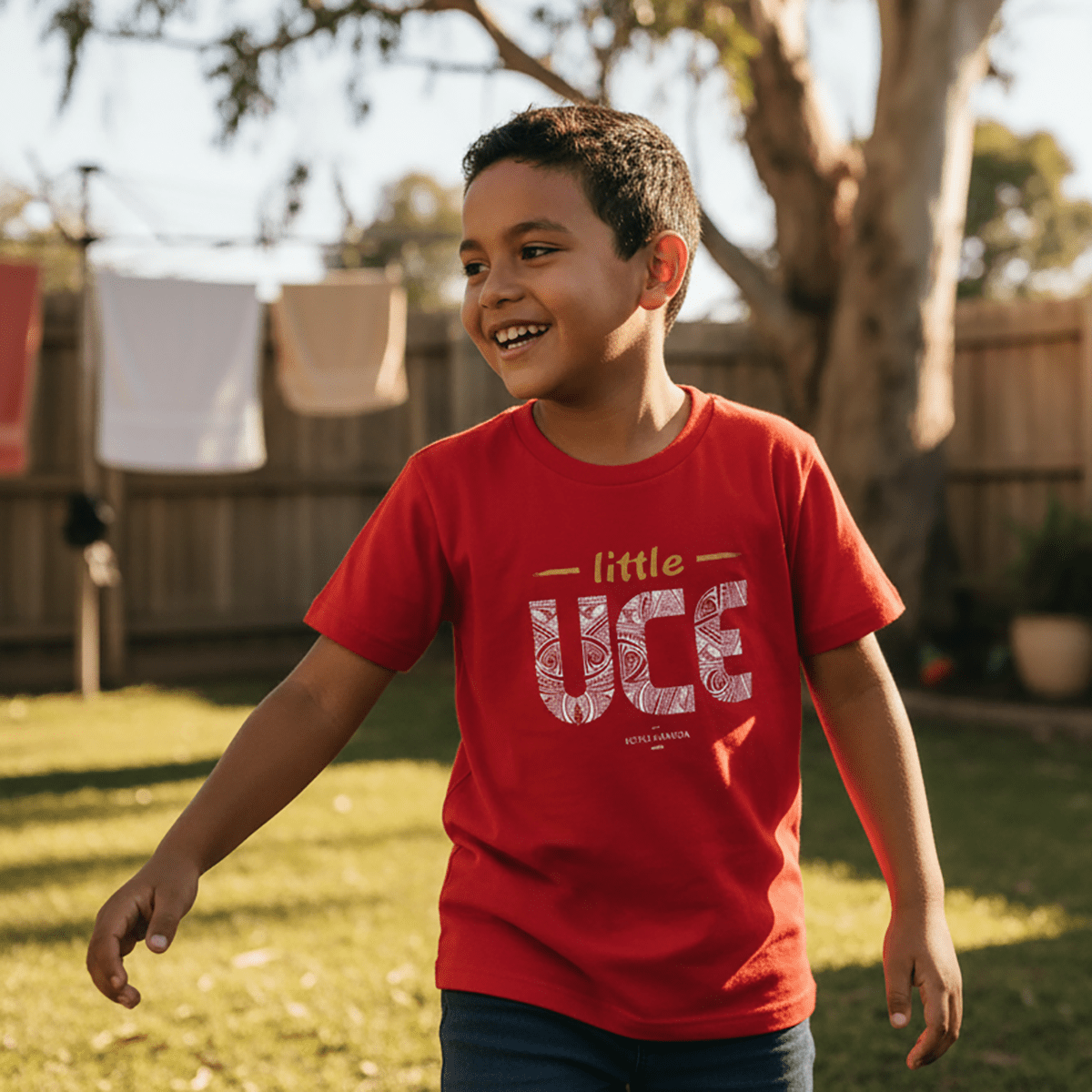 Kids unisex Little Uce tee by The Print Bar, featuring a colorful design on a comfortable cotton kids' T-shirt.