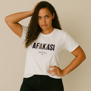 White unisex T-shirt featuring a monster digital print with "Afakasi" design, soft cotton fabric for comfort.