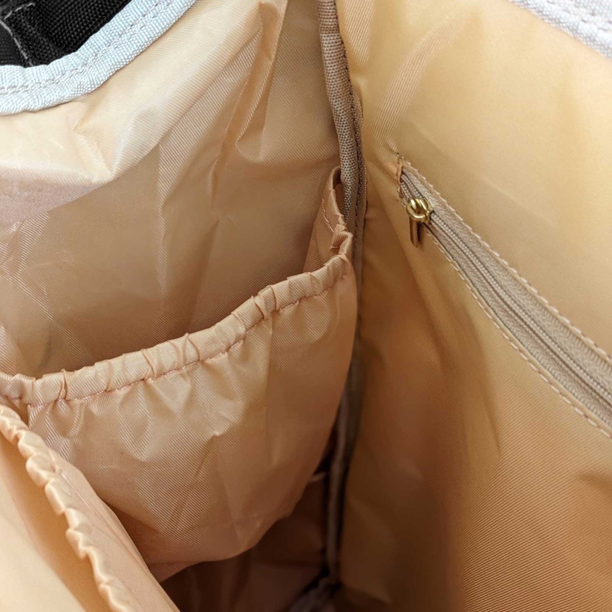 Malu multipurpose diaper bag with multiple compartments and stylish design, suitable for parents on the go.