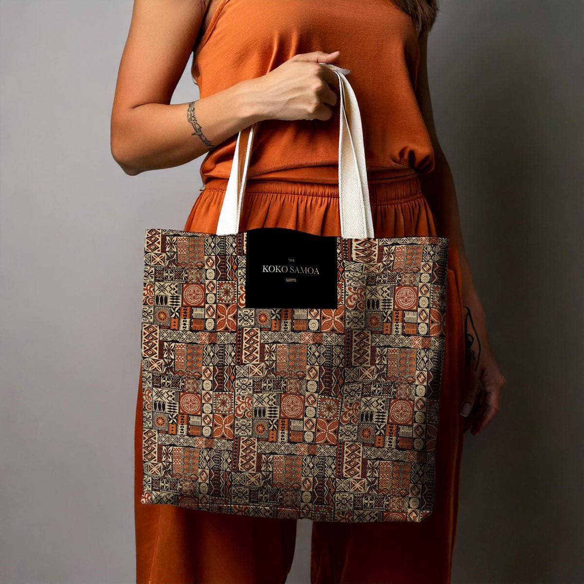 Black Elei tote bag, 13x13-inch canvas tote with sturdy handles, perfect for everyday use.