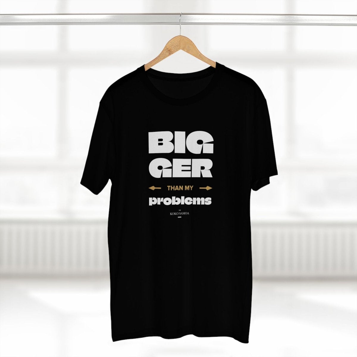 Unisex soft cotton T-shirt with "Bigger Than Problems" slogan, featuring a casual fit and simple design from The Print Bar.