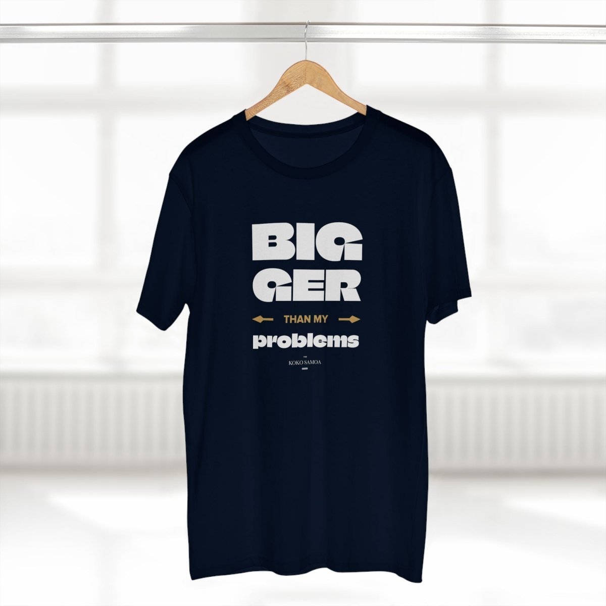 Soft unisex T-shirt from The Print Bar featuring the "Bigger Than Problems" design, worn by a person in a casual setting.