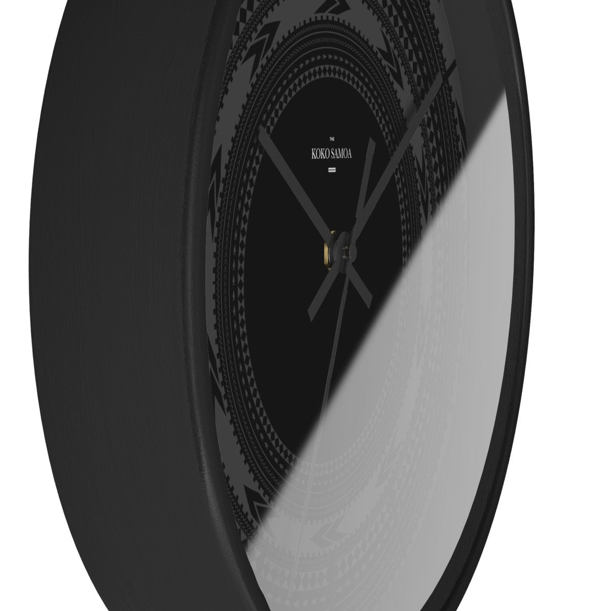 Black 10-inch wall clock with Pe'a design, suitable for home decor, featuring a black face and modern style.