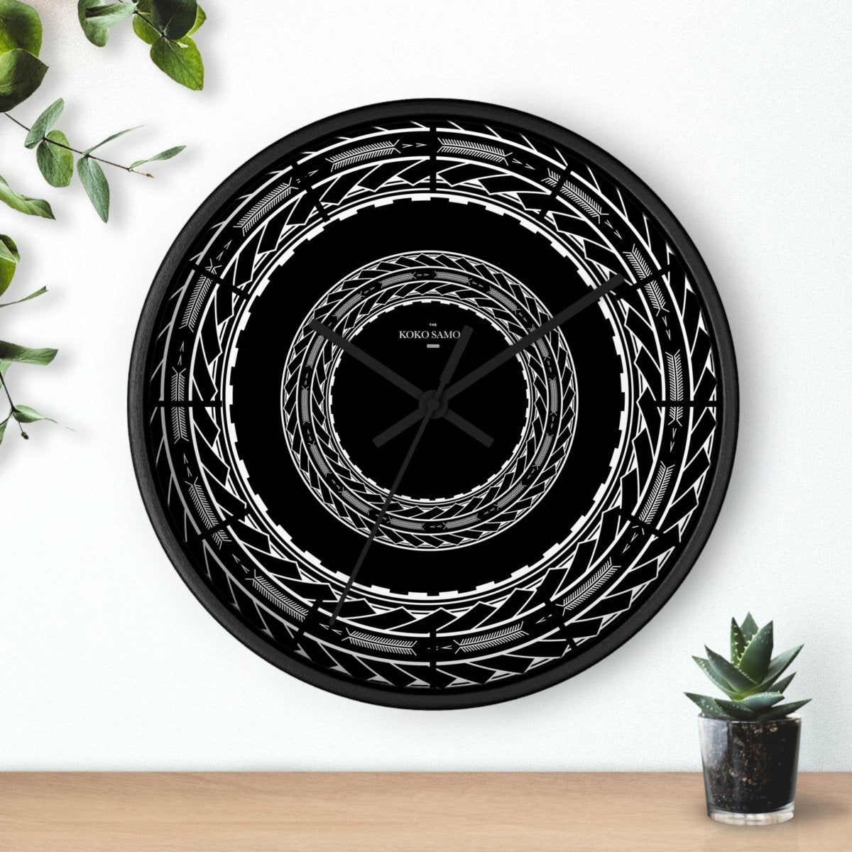 Black 10-inch wall clock featuring Samoan arrows design, perfect for home decor in AU, NZ, and USA.