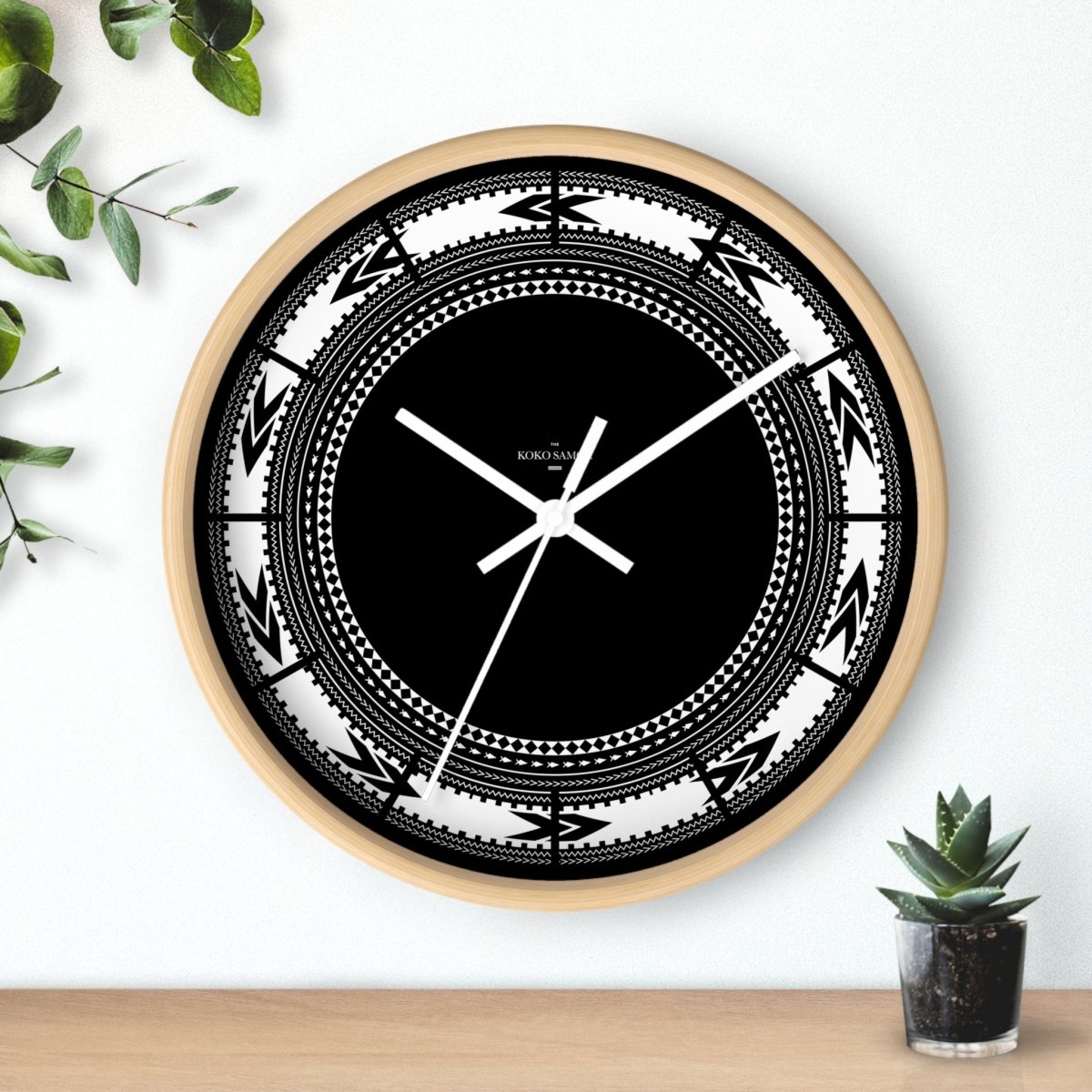 White Pe'a 10-inch wall clock with black hands and base, ideal for home decor in AU, NZ, and USA.
