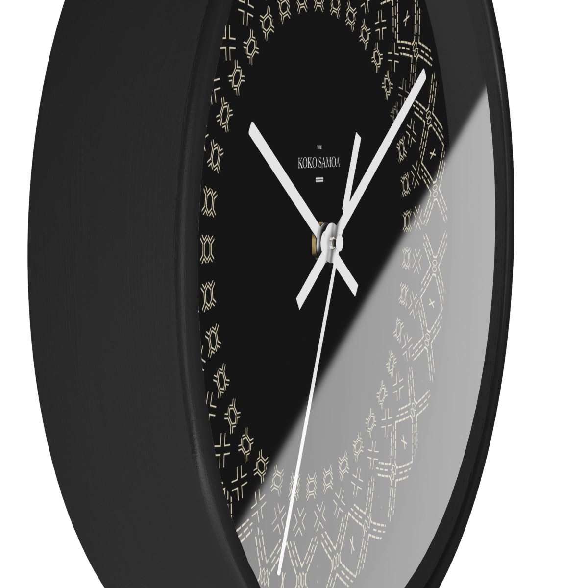 Black and white 10-inch Malu wall clock, featuring a modern home decor design with a sleek round face.