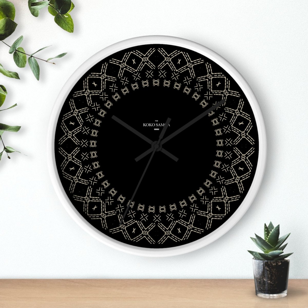 Black 10-inch Malu wall clock with white face, stylish home decor for AU, NZ, and US settings.