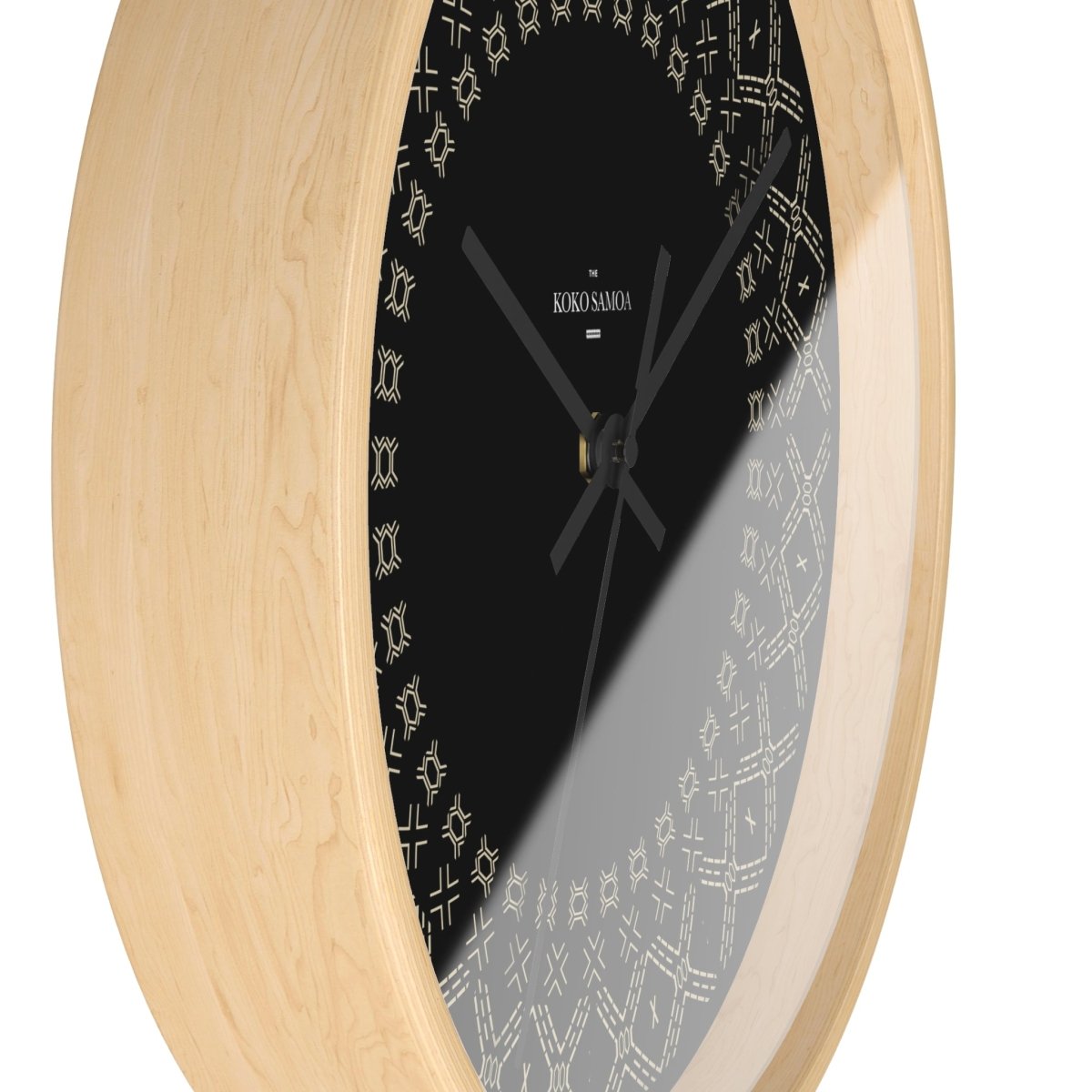 Black and white 10-inch Malu wall clock, showcasing a modern home decor design with a sleek round face.