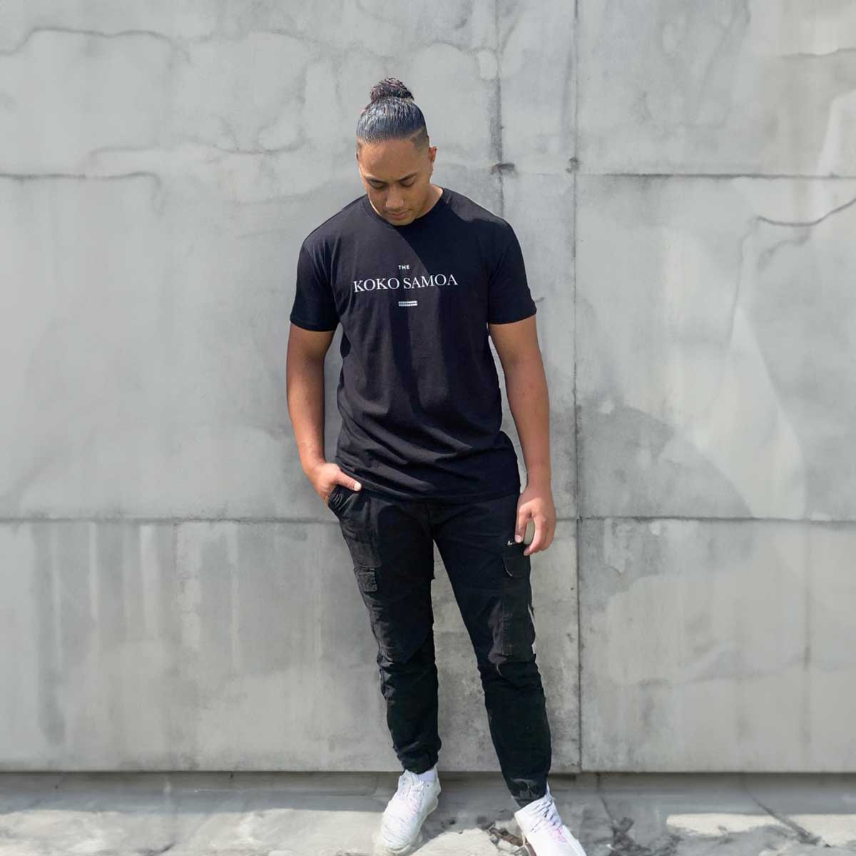 Black unisex heavy tee by The Print Bar, classic design, durable cotton fabric, versatile style for men and women.