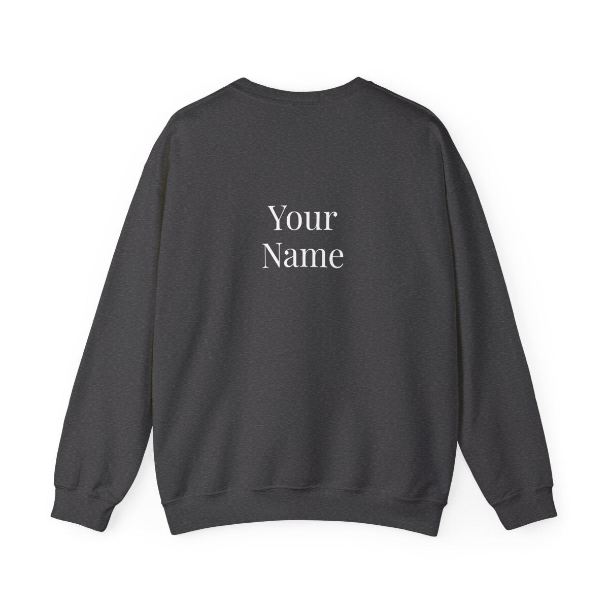 Unisex heavy sweatshirt featuring "Exclaim" design, worn by a person, in a casual indoor setting.