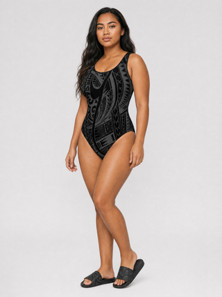 Boxing Day gift set: Women's Classic One-Piece Swimsuit in the Warrior print worn with the matching Women's Slide Sandals.