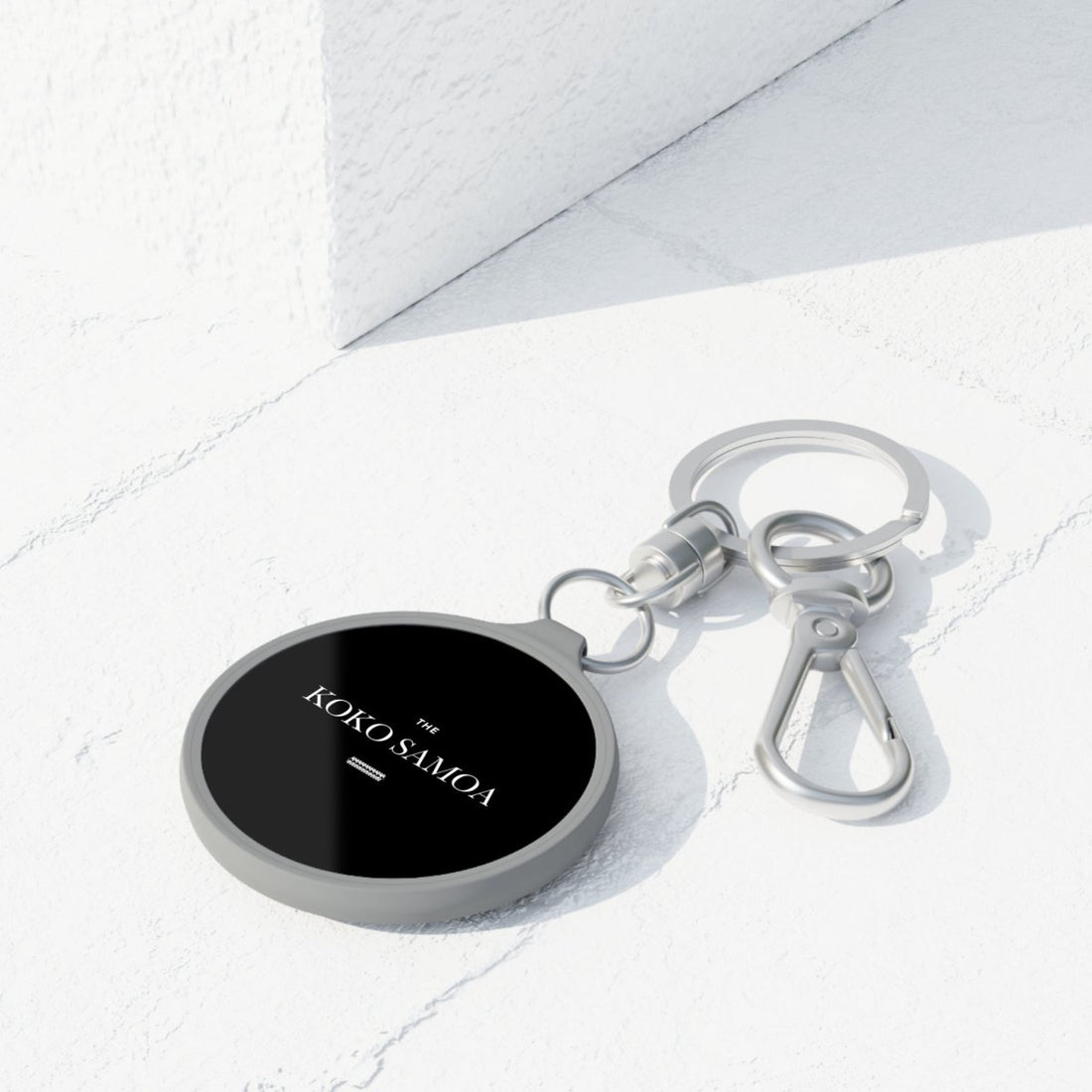 Gray WOYC The Brand Classic keyring tag, USA home decor accessory with a sleek design and versatile size.